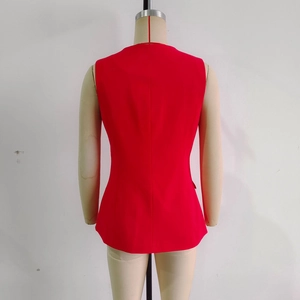 Detail of red sleeveless commuter vest back view on mannequin with sleek woven fabric