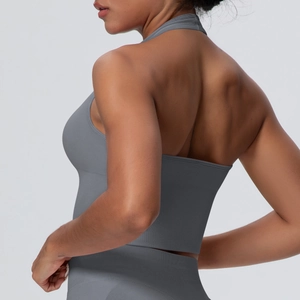 Detail of grey seamless knit fabric and stitching on back of halter neck sports bra