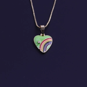 Detailed close-up of a gold heart pendant with colorful rainbow enamel and zircon inlay