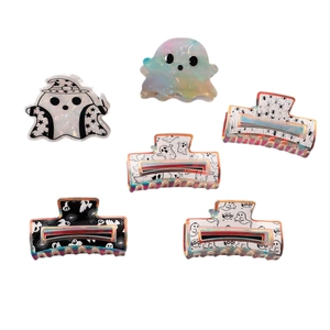 Set of Halloween hair claws featuring iridescent ghosts, spiders and BOO patterns