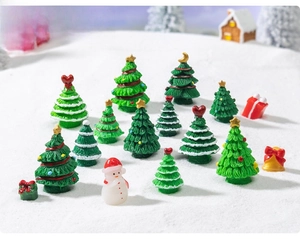 Miniature resin Christmas tree set with snowman, gift box and bells in a snow scene