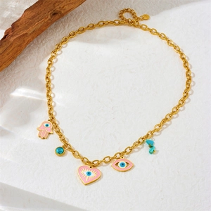 Golden multi-pendant necklace with pink and blue enamel evil eye and Hamsa heart charms