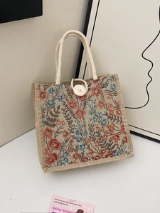 Linen canvas floral handbag with cotton rope handles and wooden button closure