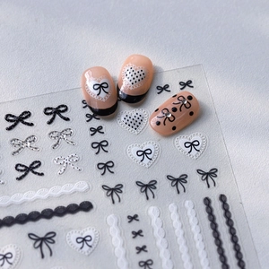 Monochrome bow and lace heart adhesive nail art stickers with 3D crystal accents