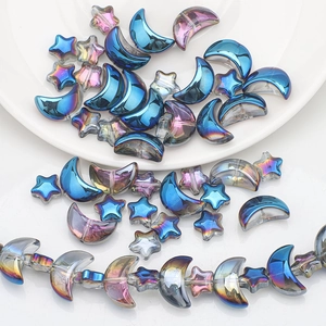 Macro shot of iridescent moon and star glass beads for DIY jewelry making kits