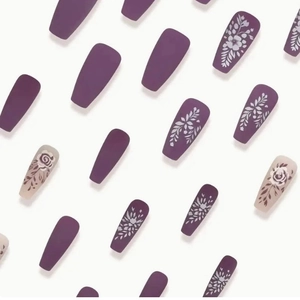 Matte purple and beige coffin press-on nails featuring white floral leaf patterns