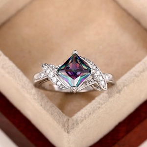 Silver square rainbow zircon ring with crisscross diamond band in a jewelry box