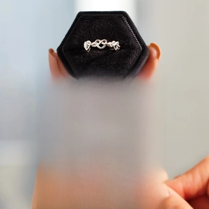 Detail of s925 silver heart knot ring with a mother's message card in a gift box