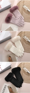 Detail of warm winter gloves for women with faux fur cuffs and touchscreen fingers