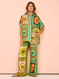 Detail of vintage floral print fabric and texture on loose summer two-piece outfit