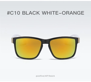 Front detail of sports sunglasses with black frame white temples and orange lenses