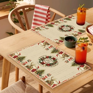 Close-up of Christmas placemats with Santa Claus and reindeer on a wooden dining table