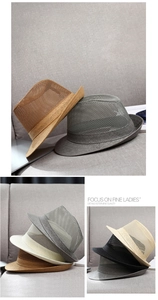 Close-up of breathable mesh texture and decorative band on summer men fedora hat