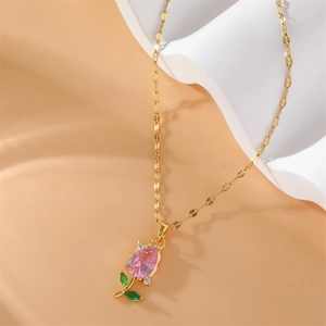 Elegant gold tulip pendant necklace with pink zircon and green leaf details on beige background