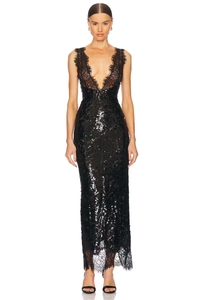 Détail de la robe de soirée noire à paillettes avec dentelle et décolleté en V profond