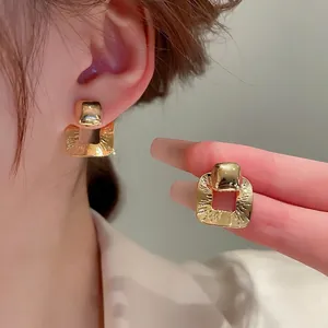 French style gold hollow square geometric stud earrings with radial engraved texture