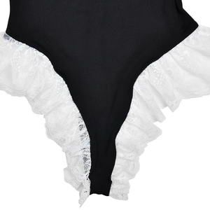 Close-up of black bodysuit featuring elegant white lace trim detail and fabric texture