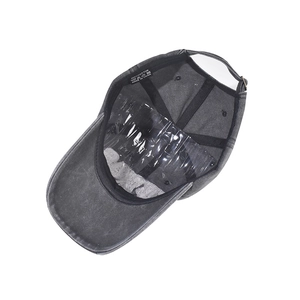 Detail view of cotton baseball cap interior with sweatband and adjustable buckle