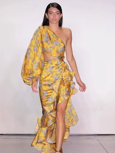 Detail of single-shoulder floral dress showing satin fabric texture and ruffled hem