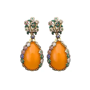 Vintage pear-shaped orange gemstone earrings with gold floral patterns and colorful zircons