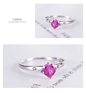 Macro detail of S925 silver ring featuring heart-cut pink zircon and side stones