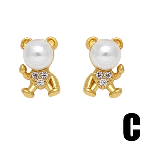 Minimalist bear stud earrings in 18k gold plated copper with pearl and zircon accents