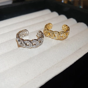 Detailed view of 18k gold and silver plated open rings with zircon studded circles