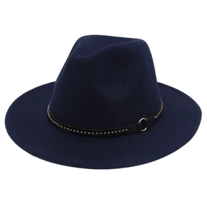 Detail view of navy blue wool fedora featuring a studded black leather band and metal ring