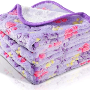 Soft purple coral fleece pet blanket with colorful paw prints and reinforced edges