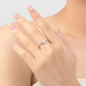 Elegant S925 sterling silver ring with a square heart-shaped clear gemstone on model finger