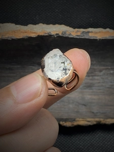 Macro detail of natural raw crystal stone on vintage adjustable copper ring band