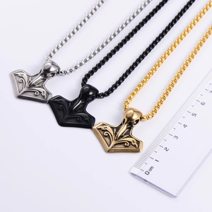 Detailed comparison of Thor's Hammer Mjolnir pendants in silver, gold, and black finishes