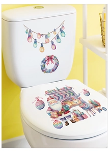 Watercolor Santa and reindeer decals applied to a white toilet seat for holiday decor