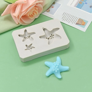 Starfish silicone mold for DIY baking with detailed floral patterns on a green background