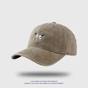 Vintage washed cotton baseball cap with puppy embroidery in earthy brown tone