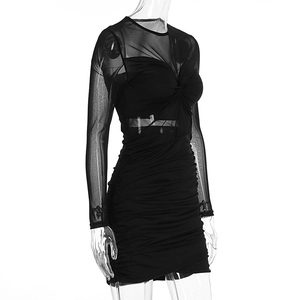 Detail of ruched black mini dress with sheer mesh sleeves and waist cut-out