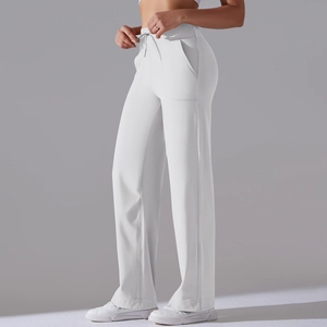 Detailed view of high-waisted wide-leg yoga pants with drawstring and side pockets