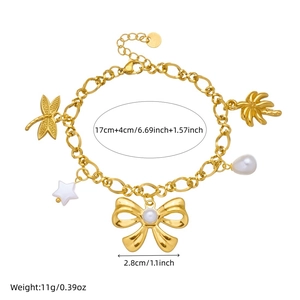 Gold-plated stainless steel charm bracelet featuring dragonfly, palm tree, and pearl charms