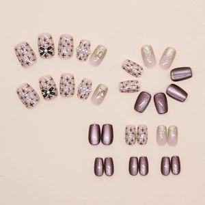 Détails de faux ongles œil de chat avec nœud papillon marron et perles élégantes