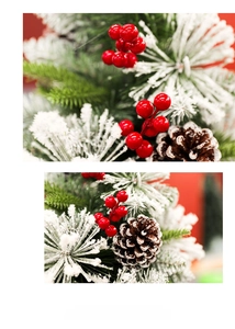 Close-up of frosted pine branches with red berries and pinecones for Christmas decor