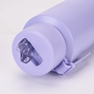 Detail of lavender vacuum bottle showing the resin nozzle, handle, and matte texture