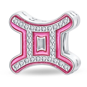 Macro detail of a silver Gemini charm with pink enamel and sparkling zircon accents