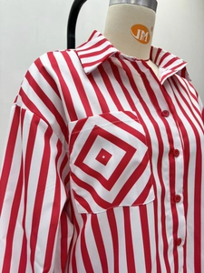 Detail of red and white vertical striped shirt with a contrast pattern chest pocket