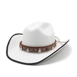 Detail of white western cowboy hat featuring ethnic braided band and silver coin charms