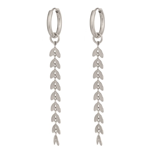 Detail of silver leaf tassel earrings showing metallic texture on white background