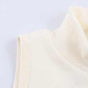 Detailed view of the fine knit texture and stitching on the cream high-neck tank top