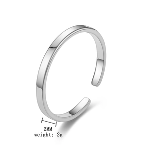 Detailed view of a 2mm wide silver minimalist ring weighing 2g on white background