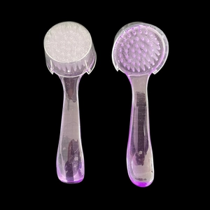 Dual-sided manual facial cleansing brush with soft bristles and silicone massage pad