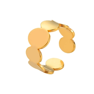 Detail of gold-plated open ring with overlapping circular polished metal discs