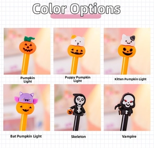 Close-up of Halloween cartoon gel pens featuring pumpkin, ghost, and vampire toppers